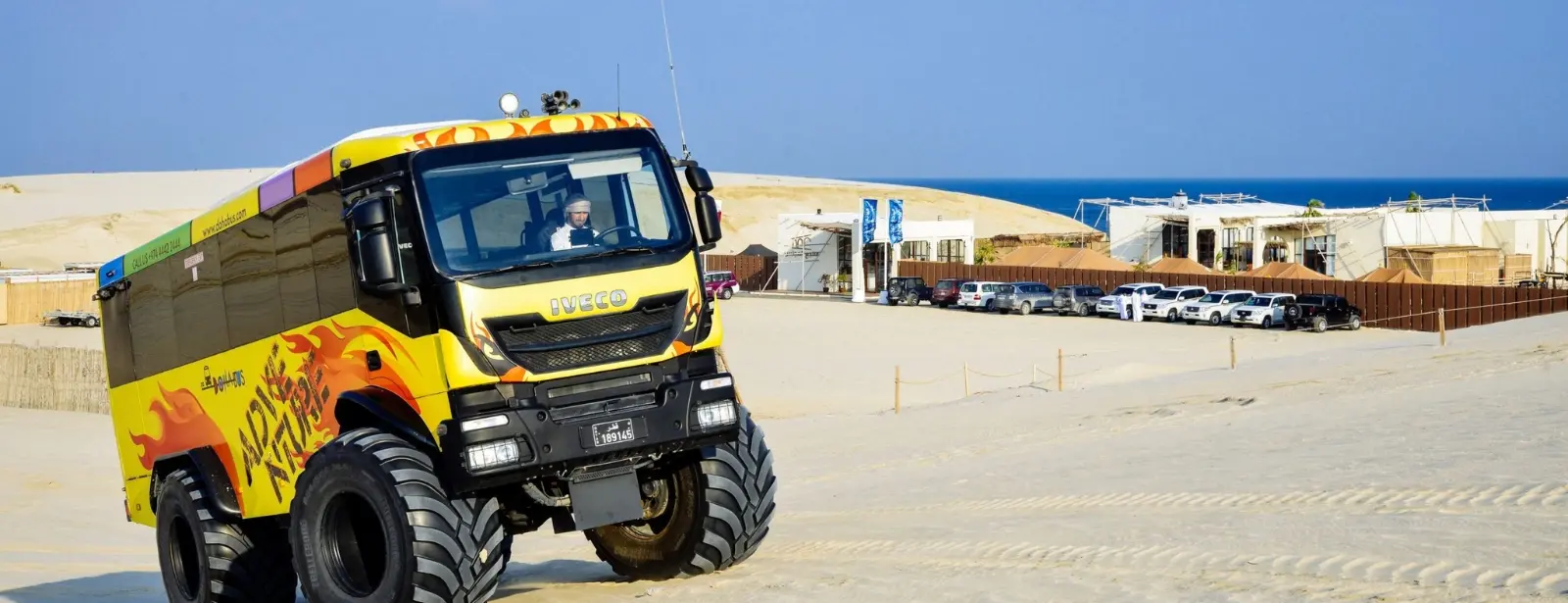 Monster Bus Tour in the Desert with Day Pass at Al Majles Resort