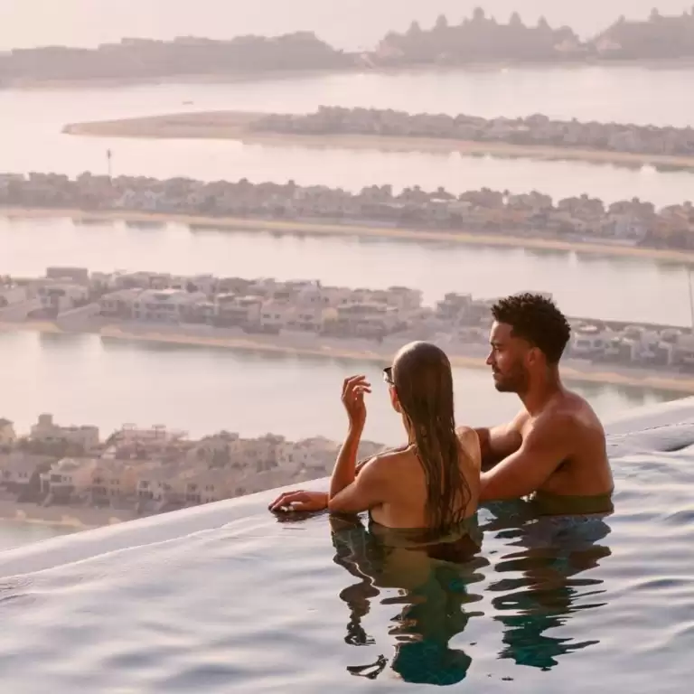 Aura sunrise pool experience with Burj view