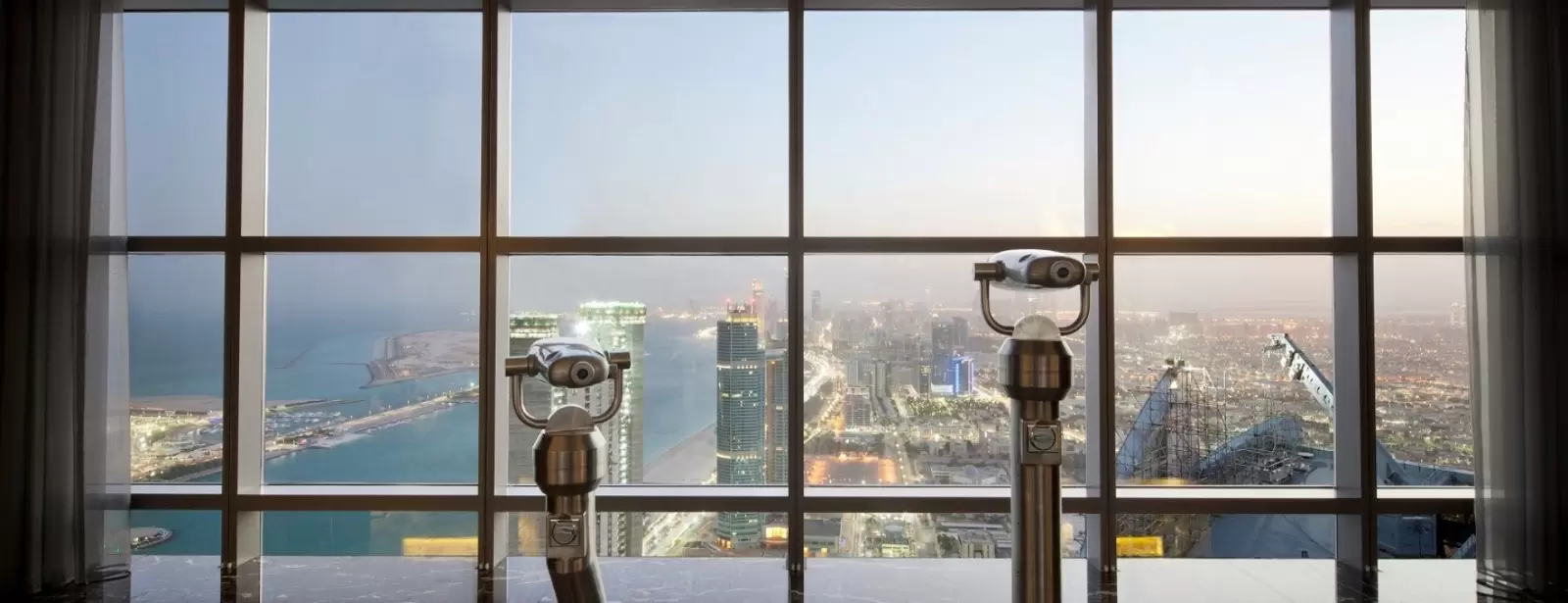Etihad Tower Observation Deck with coffee or tea and slice of cake