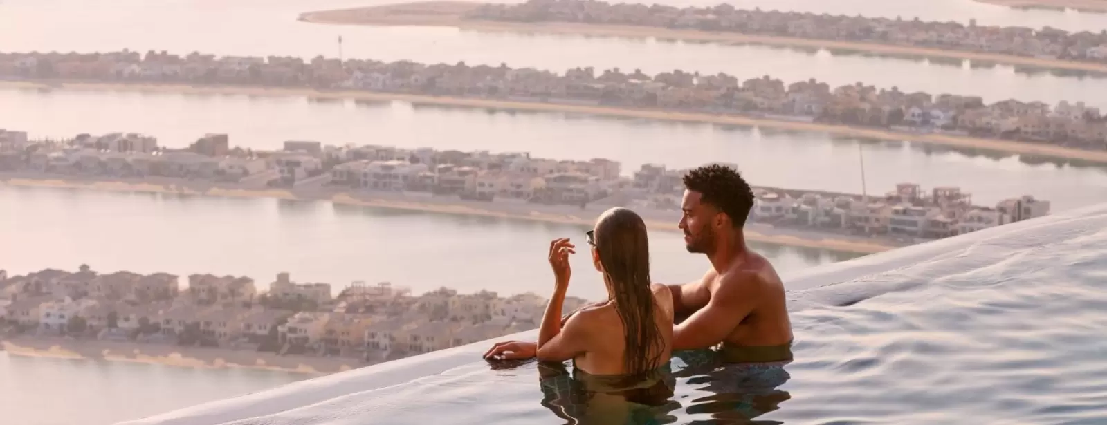 Aura sunrise pool experience with Burj view